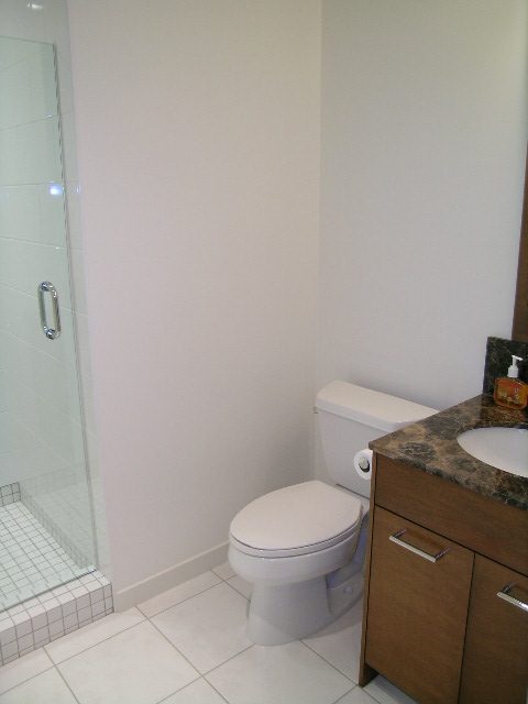 Bright bathroom with granite countertop and modern toilet. - 505 - 1005 Beach Avenue, Vancouver Downtown