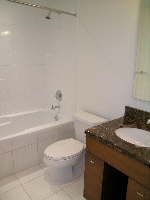 Bathroom with marble countertops, modern fixtures, and a shower. - 505 - 1005 Beach Avenue, Vancouver Downtown