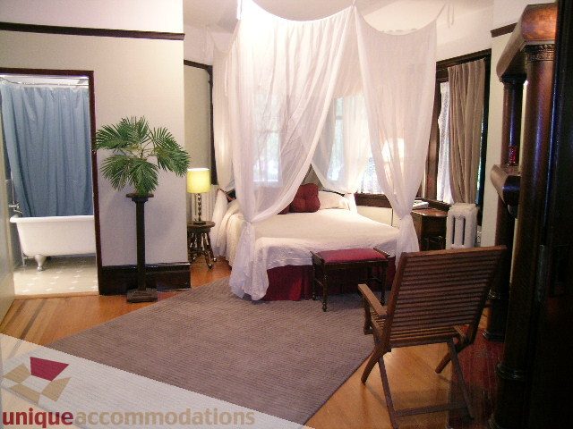 Furnished 1-bedroom suite with hardwood floors, canopy bed, and clawfoot tub. - 3 - 2812 Yukon, Vancouver West Side