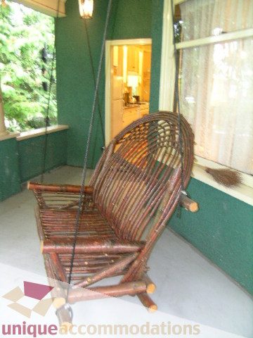 Furnished porch swing with green walls and natural light. - 3 - 2812 Yukon, Vancouver West Side