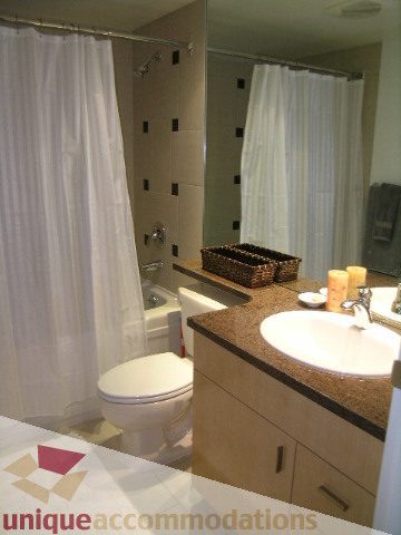 Bathroom with granite countertops and modern fixtures. - 3607 - 1033 Marinaside Crescent, Vancouver Downtown
