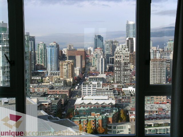 Bright living room with stunning city view and modern furnishings. - 3607 - 1033 Marinaside Crescent, Vancouver Downtown