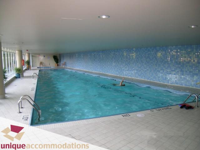 Spacious indoor pool with tiled walls and floor, modern design. - 3607 - 1033 Marinaside Crescent, Vancouver Downtown