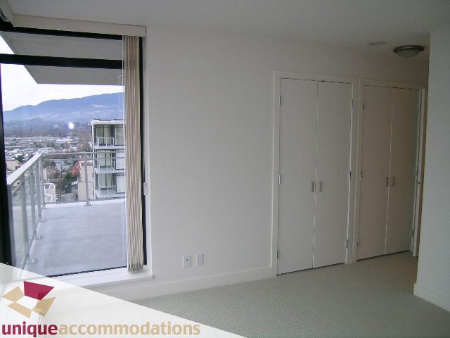 Bright living room with large windows and city view. - 1404 - 155 W. 1st Street, North Vancouver
