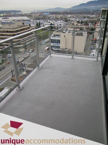 Balcony with city view and modern furnishings. - 1404 - 155 W. 1st Street, North Vancouver