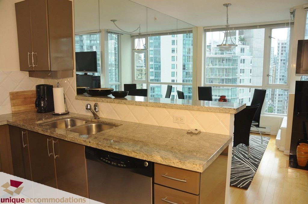 Bright kitchen with granite countertops, hardwood floors, and a city view. - 3101 - 1328 W. Pender Street, Vancouver Downtown