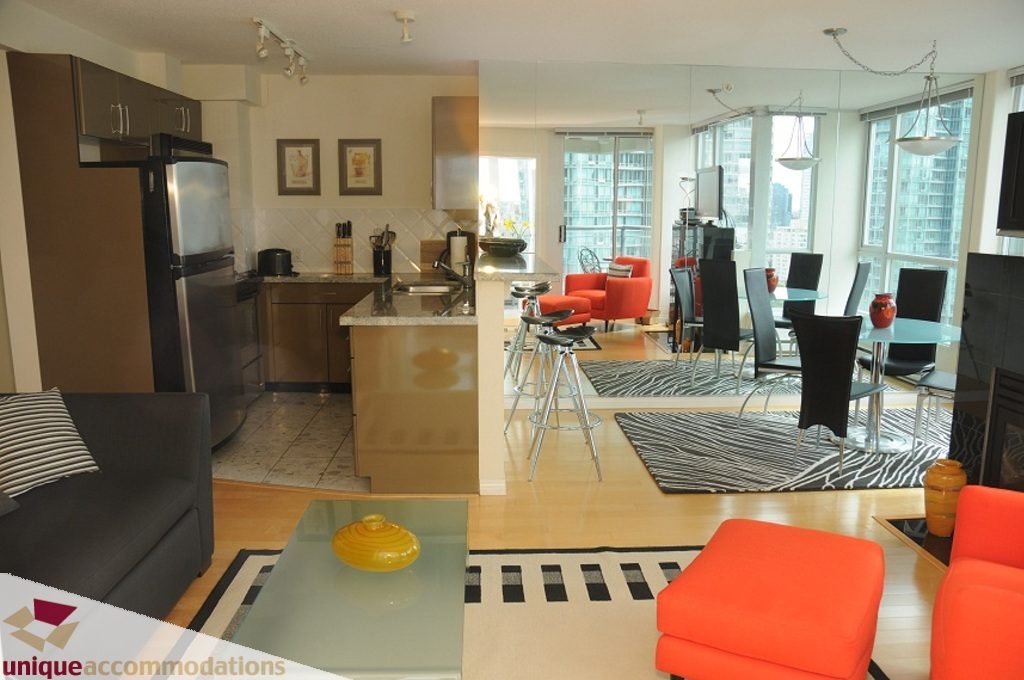Spacious open-concept living with modern furnishings, hardwood floors, and a stunning city view. - 3101 - 1328 W. Pender Street, Vancouver Downtown