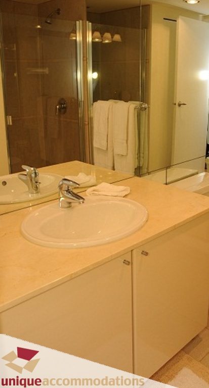 Spacious bathroom with marble countertops and a walk-in shower. - 3101 - 1328 W. Pender Street, Vancouver Downtown
