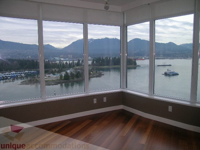 Bright living room with hardwood floors and a stunning city view. - 2101 - 1281 West Cordova Street, Vancouver Downtown