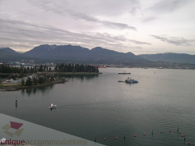 Furnished living room with city view and water access. - 2101 - 1281 West Cordova Street, Vancouver Downtown