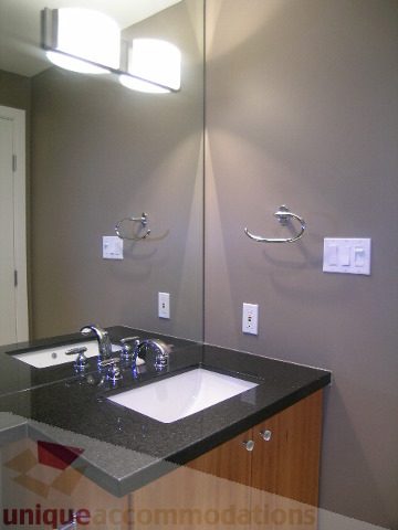 Furnished bathroom with black countertops and modern sink fixtures. - 2101 - 1281 West Cordova Street, Vancouver Downtown