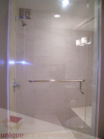 Bright bathroom with modern glass shower and sleek countertop. - 2101 - 1281 West Cordova Street, Vancouver Downtown