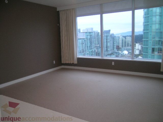 Spacious living room with large windows offering a stunning city view. - 2101 - 1281 West Cordova Street, Vancouver Downtown