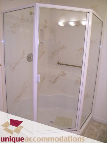 Bright bathroom with glass shower enclosure and modern fixtures. - 1416 Chartwell Drive, West Vancouver