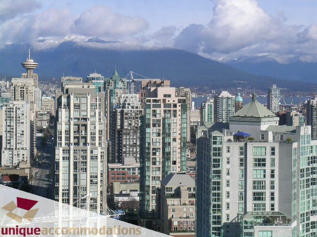 Bright living room with stunning city view and modern furnishings. - 3801 - 1438 Richards Street, Vancouver Downtown