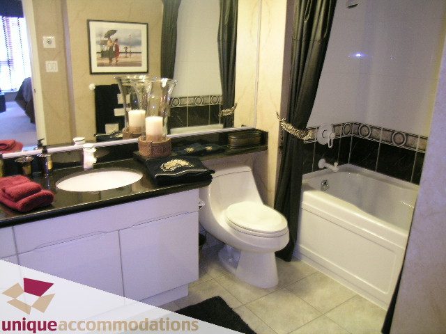 Furnished bathroom with black countertops and modern decor. - 1902 - 560 Cardero Street, Vancouver Downtown