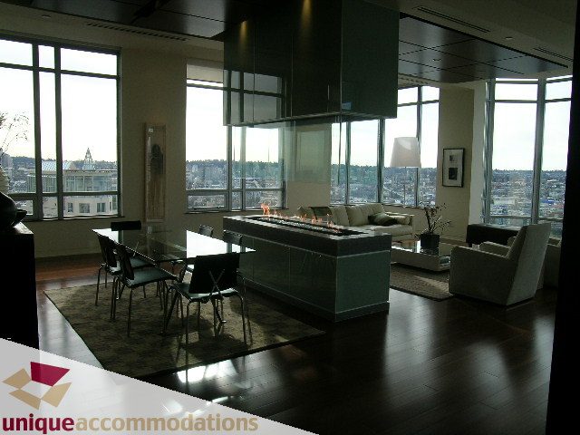 Furnished living room with hardwood floors, city view, and modern decor. - 2901 - 1005 Beach Avenue, Vancouver Downtown