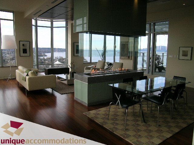 Furnished living room with hardwood floors, city view, and modern decor. - 2901 - 1005 Beach Avenue, Vancouver Downtown