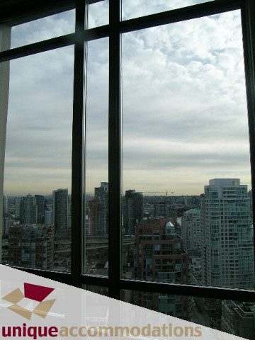 Bright living room with expansive city view and modern furnishings. - 2901 - 1005 Beach Avenue, Vancouver Downtown