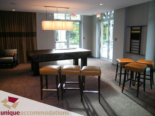 Furnished dining area with leather stools and modern lighting, overlooking city view. - 2901 - 1005 Beach Avenue, Vancouver Downtown