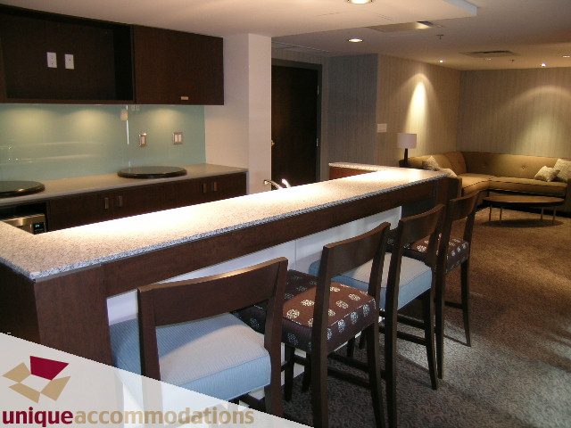 Furnished kitchen with granite countertops and bar seating. - 2901 - 1005 Beach Avenue, Vancouver Downtown