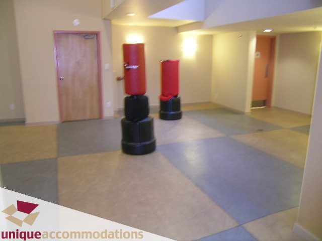 Loft with red punching bags, tiled floor, and neutral walls. - 2001 - 1238 Richards Street, Vancouver Downtown