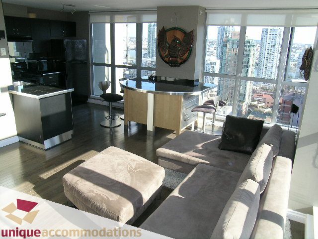 Furnished living room with hardwood floors, city view, and modern decor. - 2001 - 1238 Richards Street, Vancouver Downtown