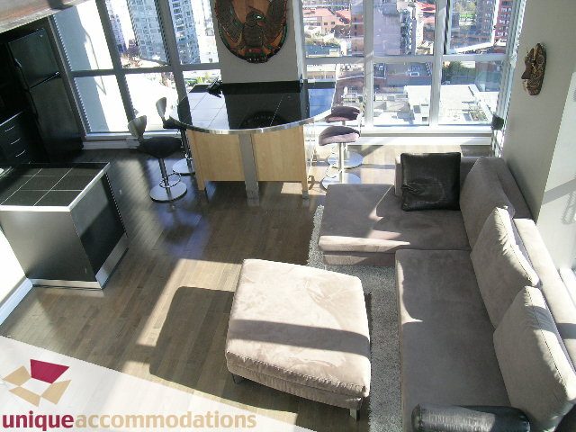 Furnished loft with hardwood floors, city view, and modern decor. - 2001 - 1238 Richards Street, Vancouver Downtown