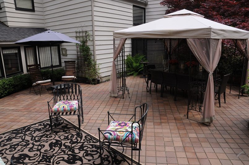 Furnished patio with outdoor furniture and a gazebo, perfect for relaxation. - Guest House - 440 Stevens Drive, West Vancouver