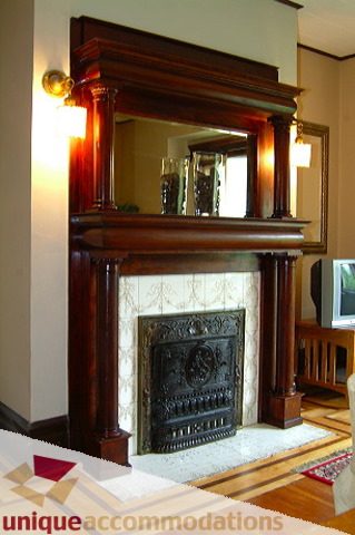 Furnished living room with ornate fireplace and hardwood floors. - 1 - 2812 Yukon, Vancouver West Side