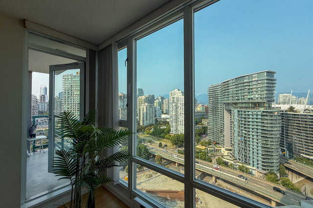Bright living room with stunning city view and modern furnishings. - 2602 - 1033 Marinaside Crescent, Vancouver Downtown