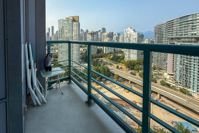 Furnished balcony with a stunning city view and modern high-rise buildings. - 2602 - 1033 Marinaside Crescent, Vancouver Downtown