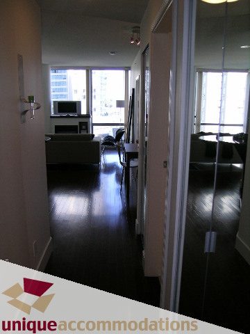 Bright living room with hardwood floors and city view. - 302 - 1228 West Hastings Street, Vancouver Downtown