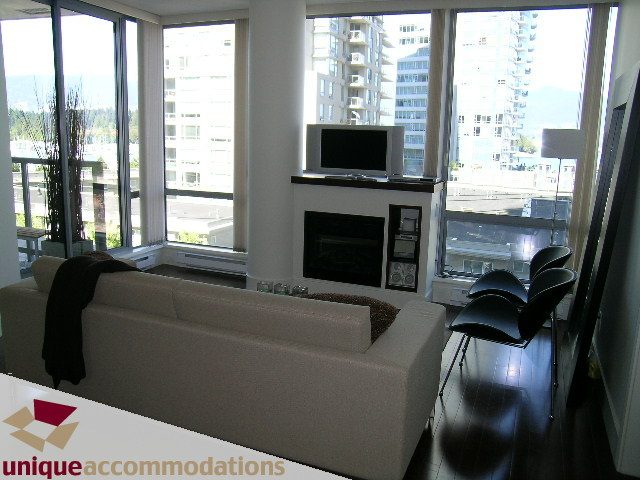 Furnished living room with city view, hardwood floors, and modern decor. - 302 - 1228 West Hastings Street, Vancouver Downtown