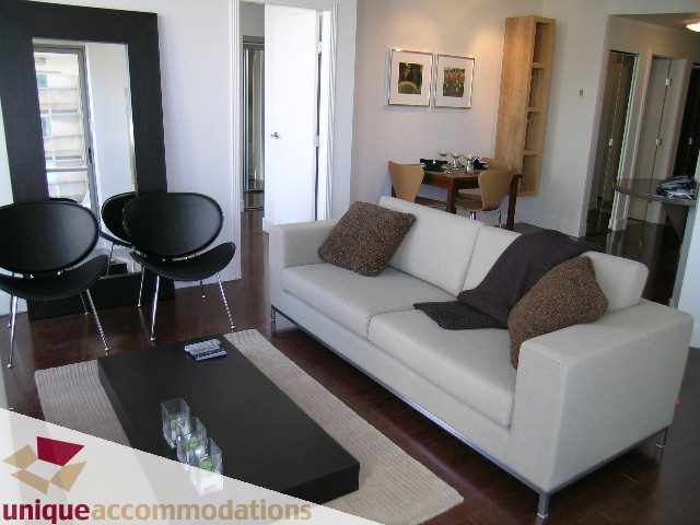 Bright living room with modern furniture and hardwood floors. - 302 - 1228 West Hastings Street, Vancouver Downtown