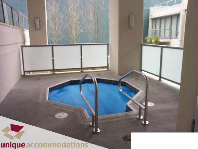 Bright outdoor patio with a small swimming pool and modern railings. - 302 - 1228 West Hastings Street, Vancouver Downtown