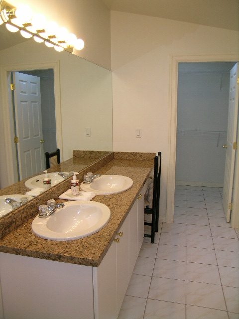 Bathroom with granite countertops and tiled floor. - 1250 Seymour Blvd, North Vancouver