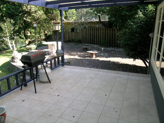 Furnished patio with tiled flooring and outdoor grill. - 1250 Seymour Blvd, North Vancouver