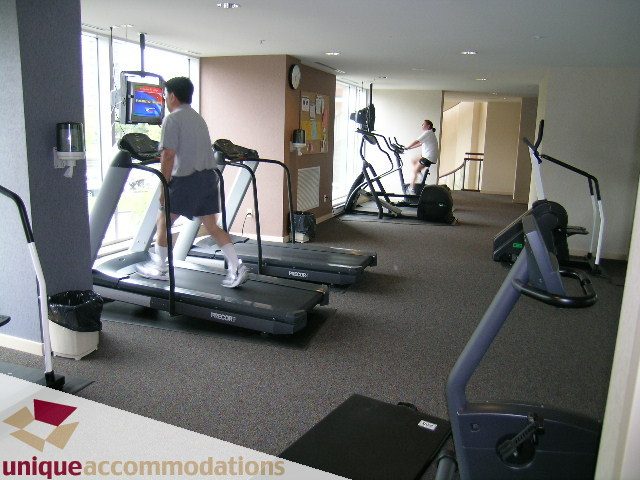 Bright gym with treadmills and exercise bikes, spacious and well-lit. - 3601-193 Aquarius Mews, Vancouver Downtown