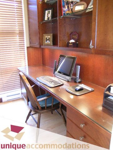 Furnished office with wooden desk, computer, and shelves. - 3601-193 Aquarius Mews, Vancouver Downtown