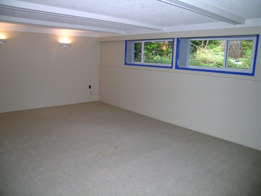 Spacious den with carpeted floor, large windows, and natural light. - 2331 Hyannis Drive, North Vancouver