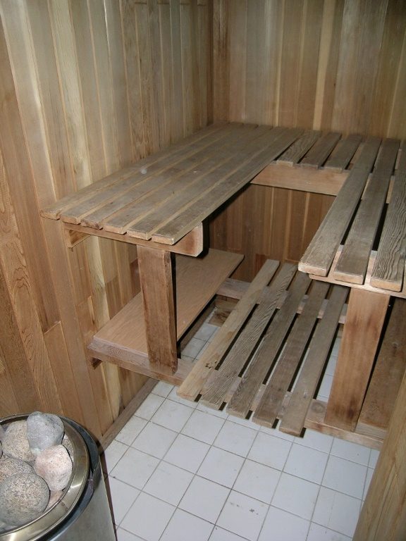 Spacious sauna with wooden benches and tiled floor, perfect for relaxation. - 2331 Hyannis Drive, North Vancouver