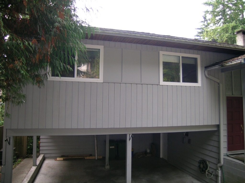 Spacious 3-bedroom + den house with modern exterior, large windows, and attached garage. - 2331 Hyannis Drive, North Vancouver