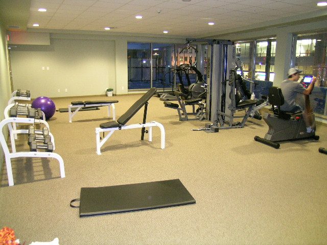 Fitness room with exercise equipment and large windows. - 930 Beatty Street, Vancouver Downtown