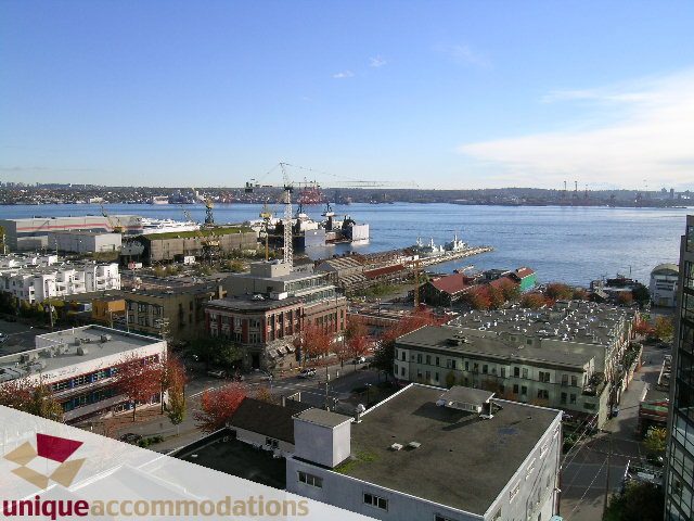 Furnished living room with city view and waterfront access. - PH1 - 125 West 2nd Street, North Vancouver
