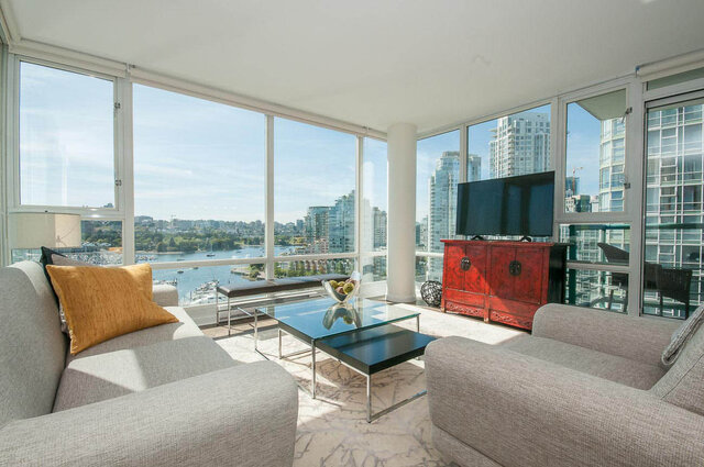 Bright living room with panoramic waterfront view and contemporary furnishings. - 1703-1067 Marinaside Crescent, Vancouver Downtown