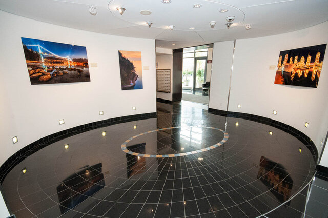 Lobby with glossy black tile floor and cityscape wall art. - 1703-1067 Marinaside Crescent, Vancouver Downtown