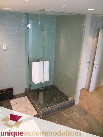Furnished bathroom with glass shower and modern tile design. - 2601 - 1077 West Cordova Street, Vancouver Downtown