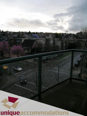 Furnished balcony with city view and cherry blossom trees. - 406 - 1688 Cypress Street, Vancouver West Side