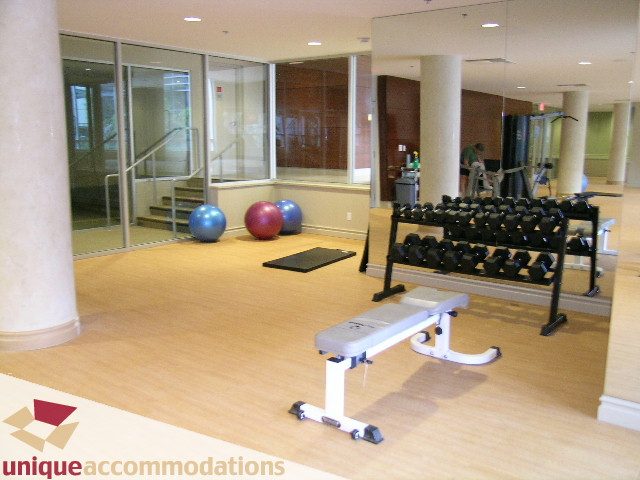 Furnished fitness room with dumbbells and exercise balls, hardwood floors. - 1805 - 428 Beach Crescent, Vancouver Downtown